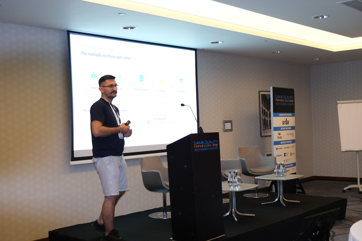 An image of Norbert presenting the six challenges at GQF 2026